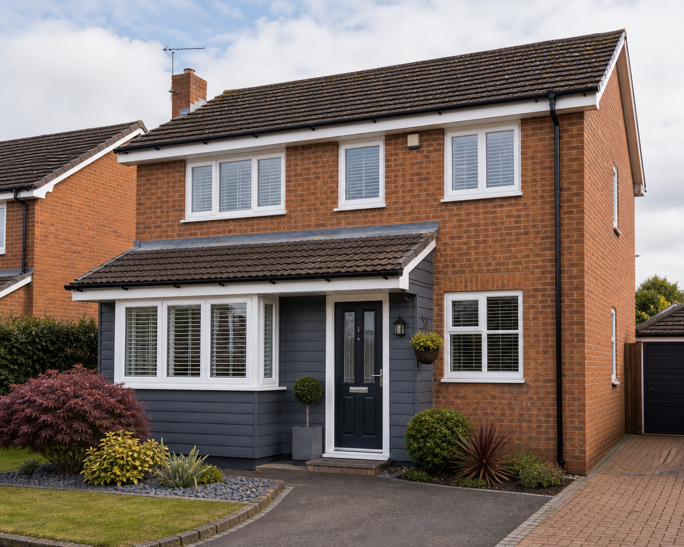 Evesham family home with white windows, dark door and clean roofline.